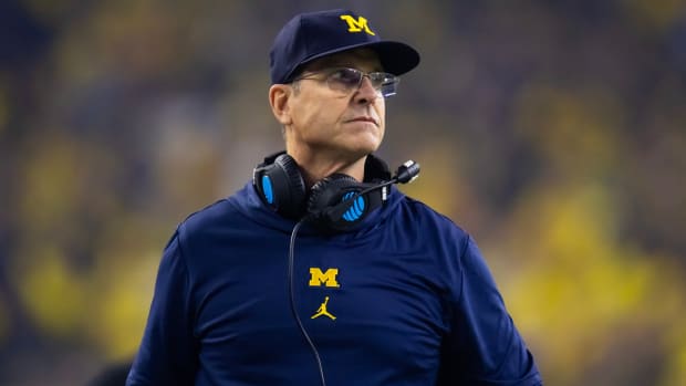 Michigan Wolverines head coach Jim Harbaugh looks on from the sideline against the Washington Huskies in the 2024 College Football Playoff national championship game.